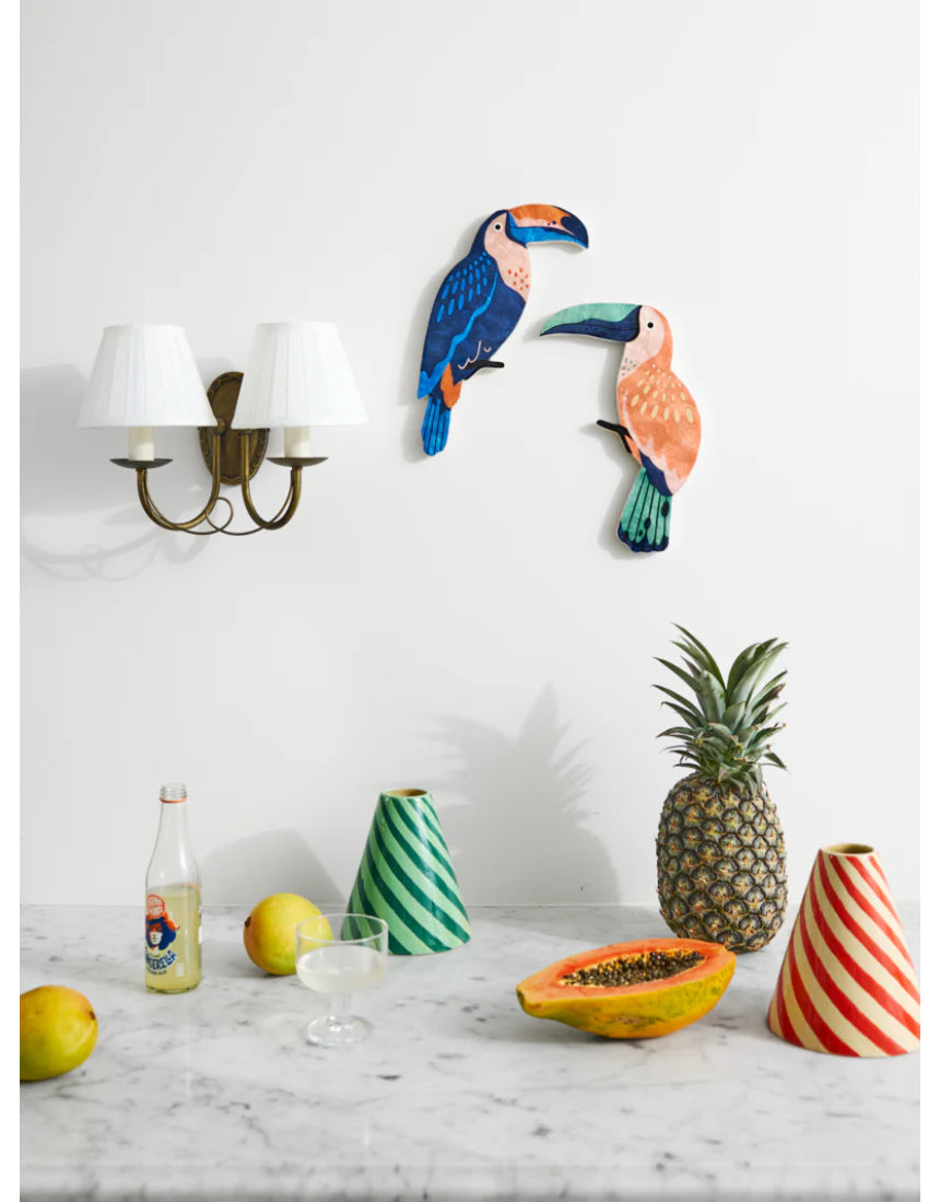 Jones & Co Canopy Toucan Peach wall art featuring a colorful toucan perched on branches with vibrant peach and green foliage.