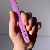 Hanami Nano Glass Nail File and Buffer from Hanami Cosmetics, showing the sleek, clear glass nail file on a white background.