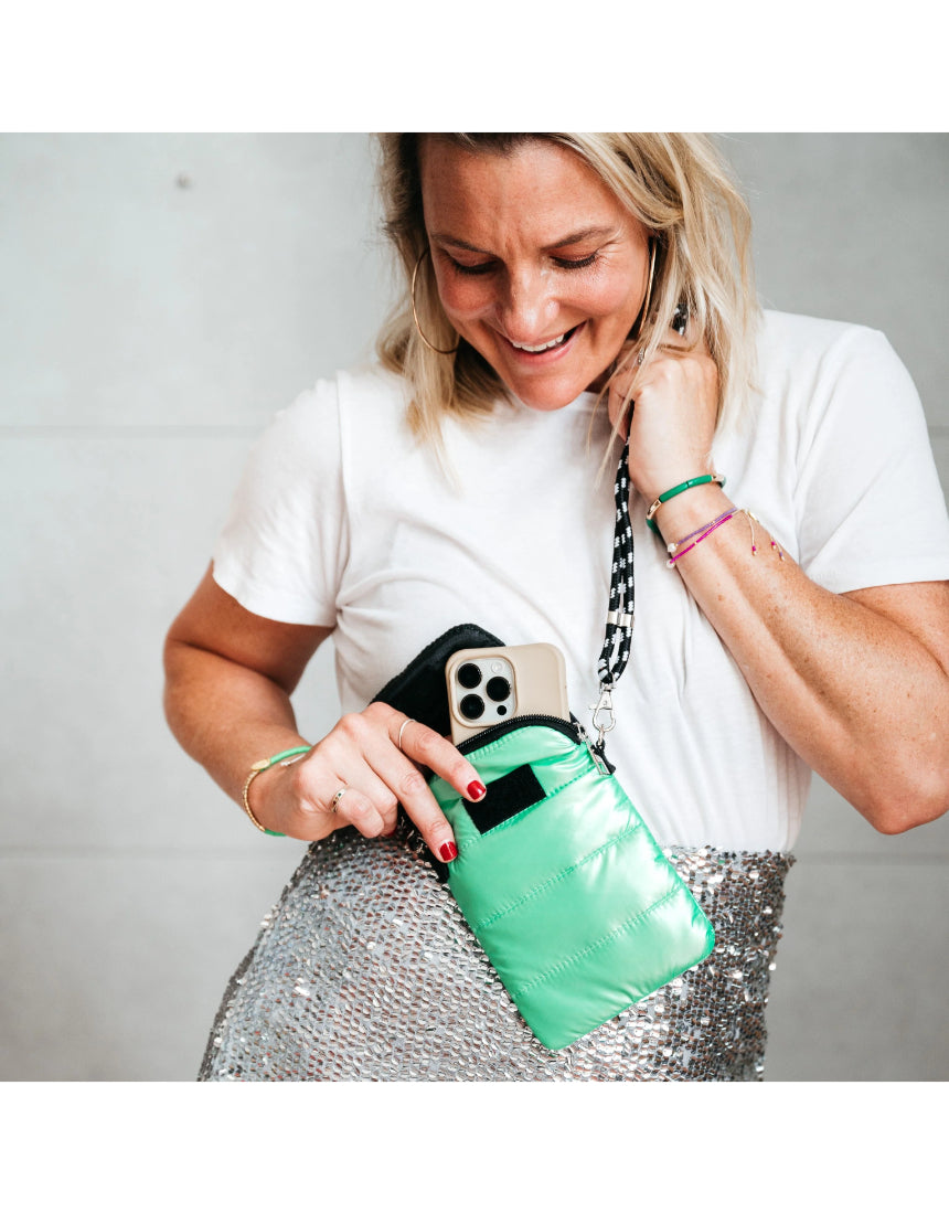 Say It Sister Amour phone pouch bag in salty safari print with adjustable strap and zip closure, stylish and compact accessory.