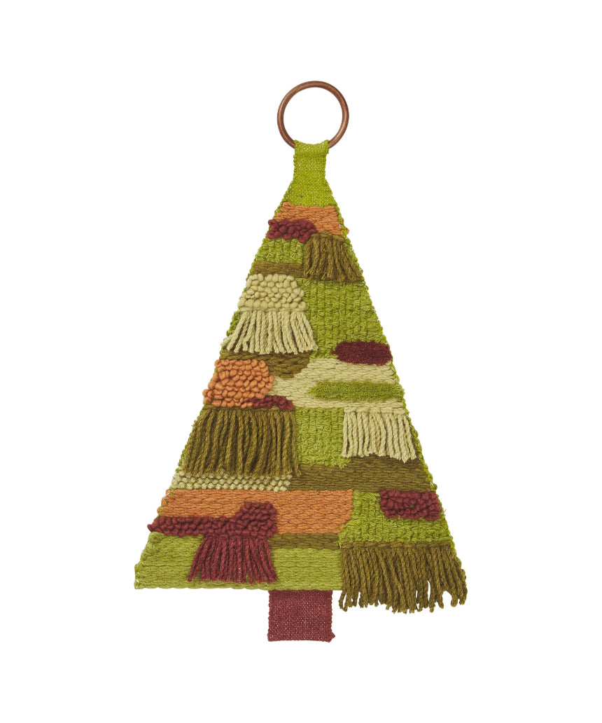 Sage x Clare Junga Christmas Tree wall hanging with colorful fabric leaves and decorative tassels on a neutral background.