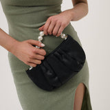 Victoria Satin Pearl Strap Bag by Angels Whisper Accessories in black, featuring a sleek satin finish and elegant pearl strap.