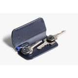 Bellroy Key Cover Plus 3rd Edition in navy with three key rings, compact leather key organizer on a white background.