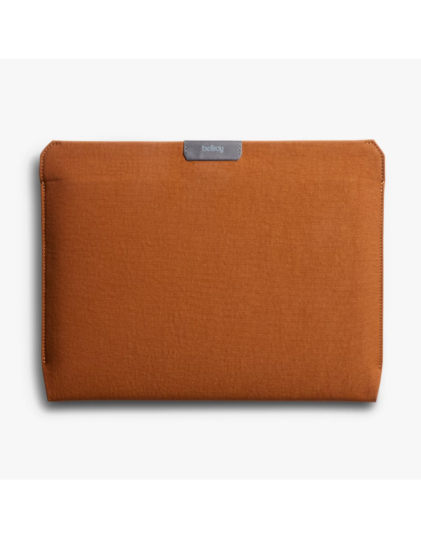 Bellroy 16-inch bronze laptop sleeve with padded interior and sleek design, featuring a smooth zipper and minimal aesthetic.