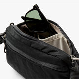 Black Bellroy Lite Belt Bag with adjustable strap and multiple compartments, designed for convenient everyday carrying.