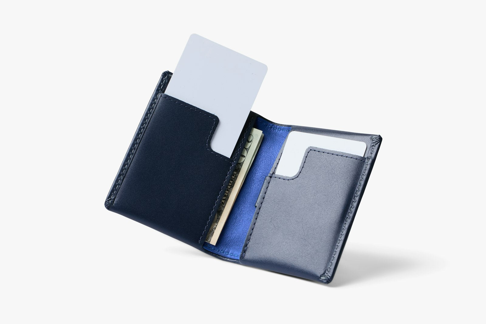 Bellroy Slim Sleeve wallet in navy color, slim leather wallet with card slots and minimalist design.