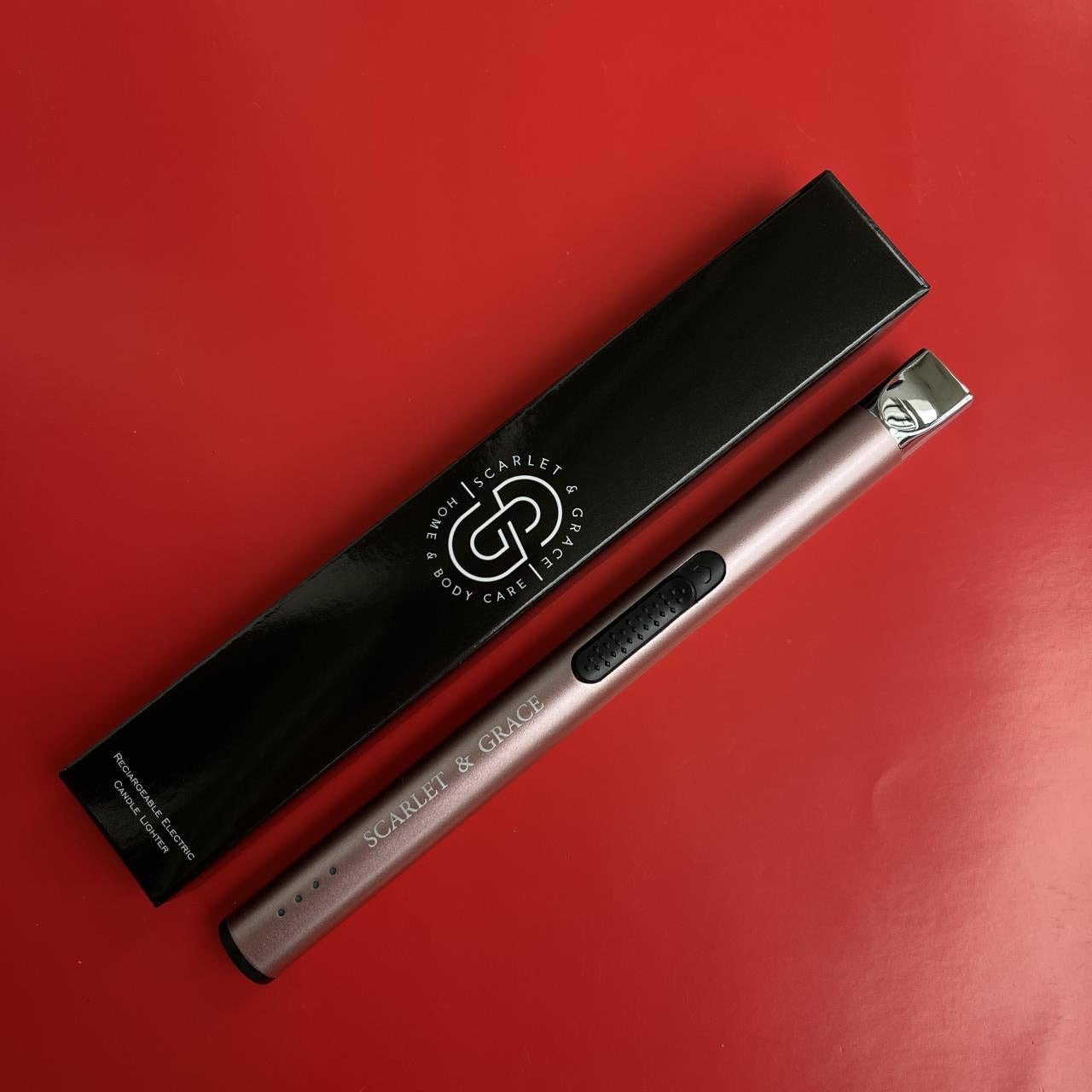 Scarlet & Grace rechargeable lighter in rose gold with sleek design and electric ignition, suitable for candles and outdoor use.