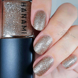 Hanami Cosmetics Dancing On My Own nail polish bottle with pink and purple gradient design, showcasing vibrant nail polish color.