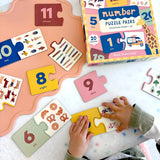 Lauren Sissons Studio Number Puzzle Pairs featuring colorful, interlocking number tiles for educational and brain-teasing fun.