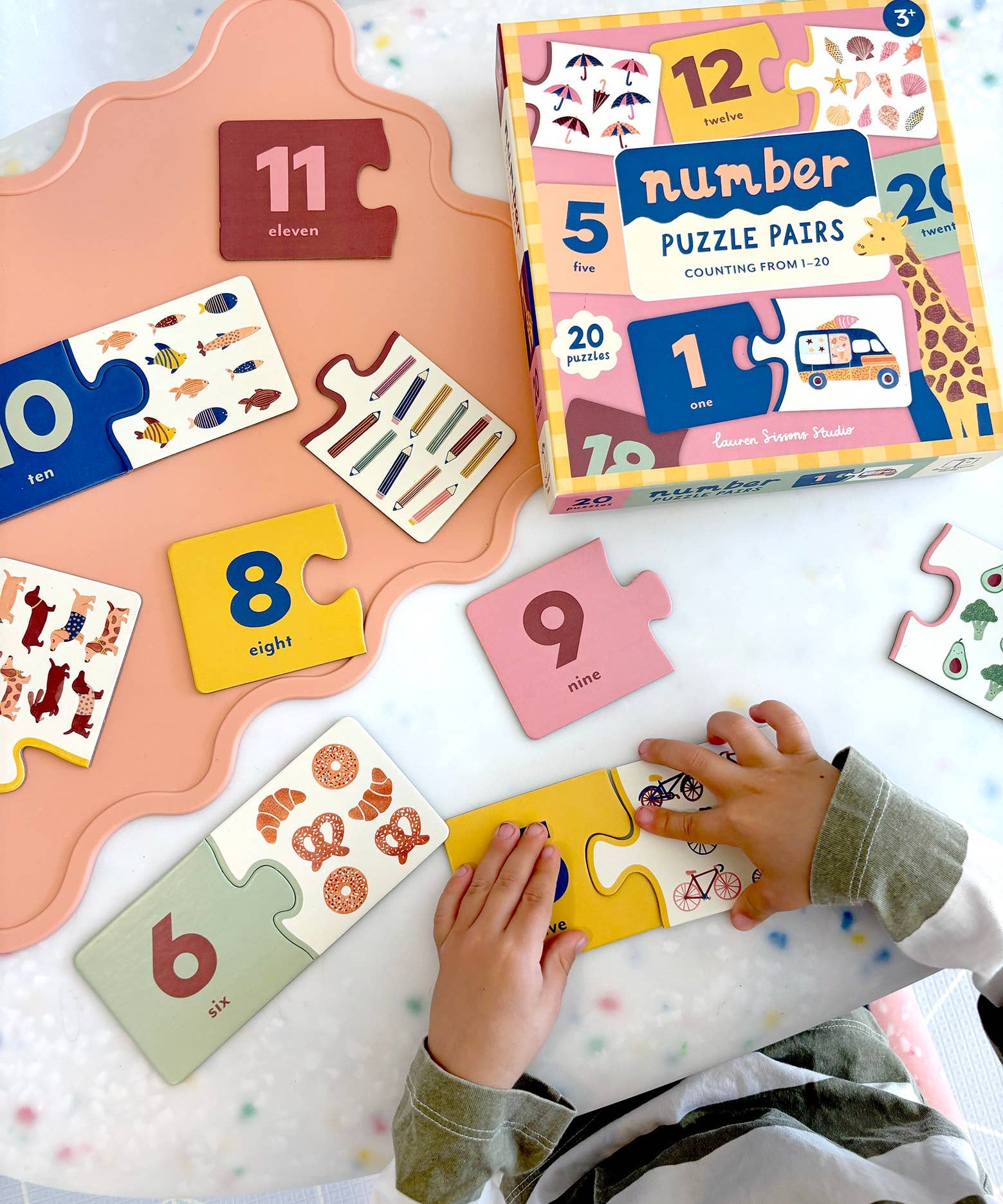 Lauren Sissons Studio Number Puzzle Pairs featuring colorful, interlocking number tiles for educational and brain-teasing fun.