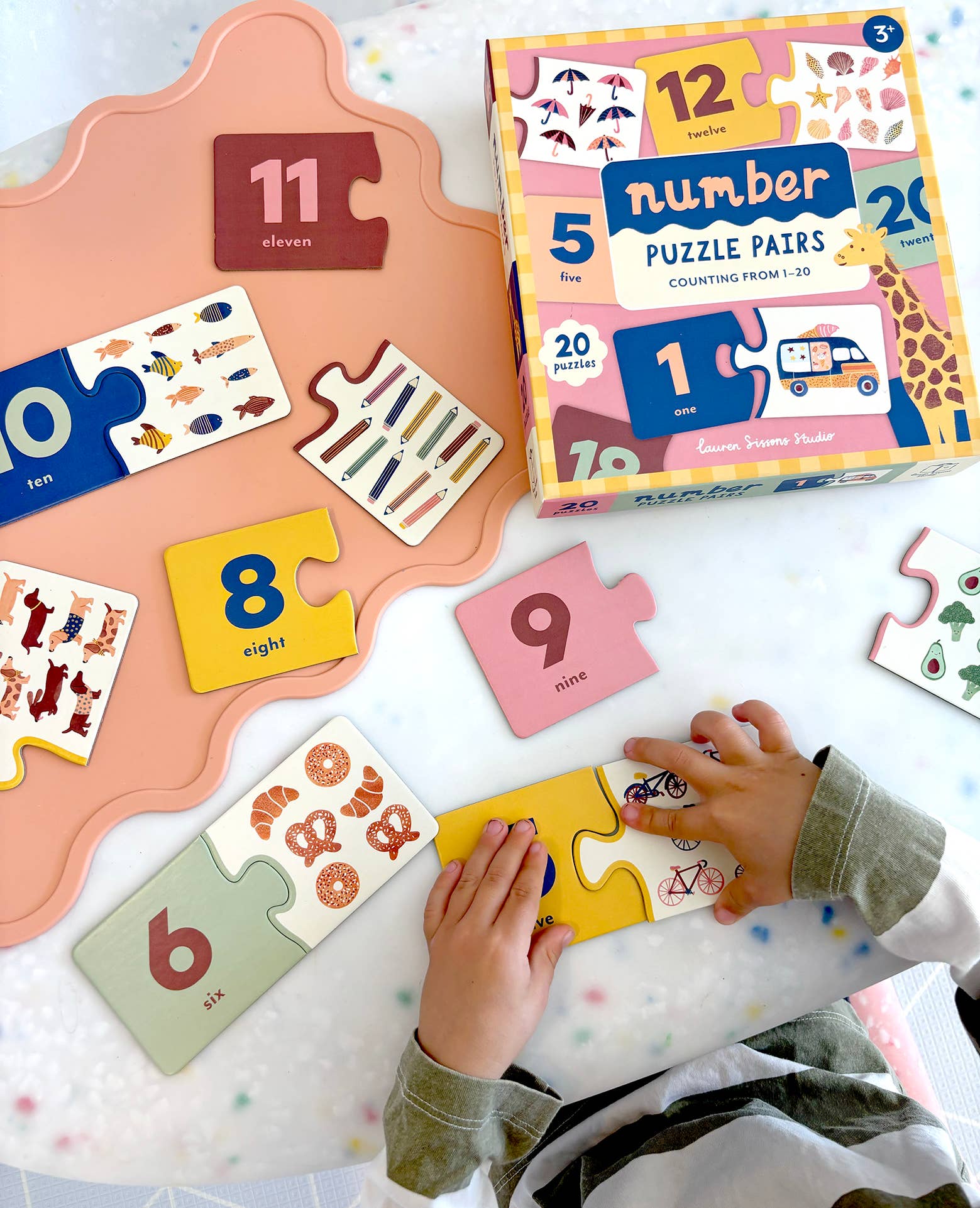 Lauren Sissons Studio Number Puzzle Pairs featuring colorful, interlocking number tiles for educational and brain-teasing fun.