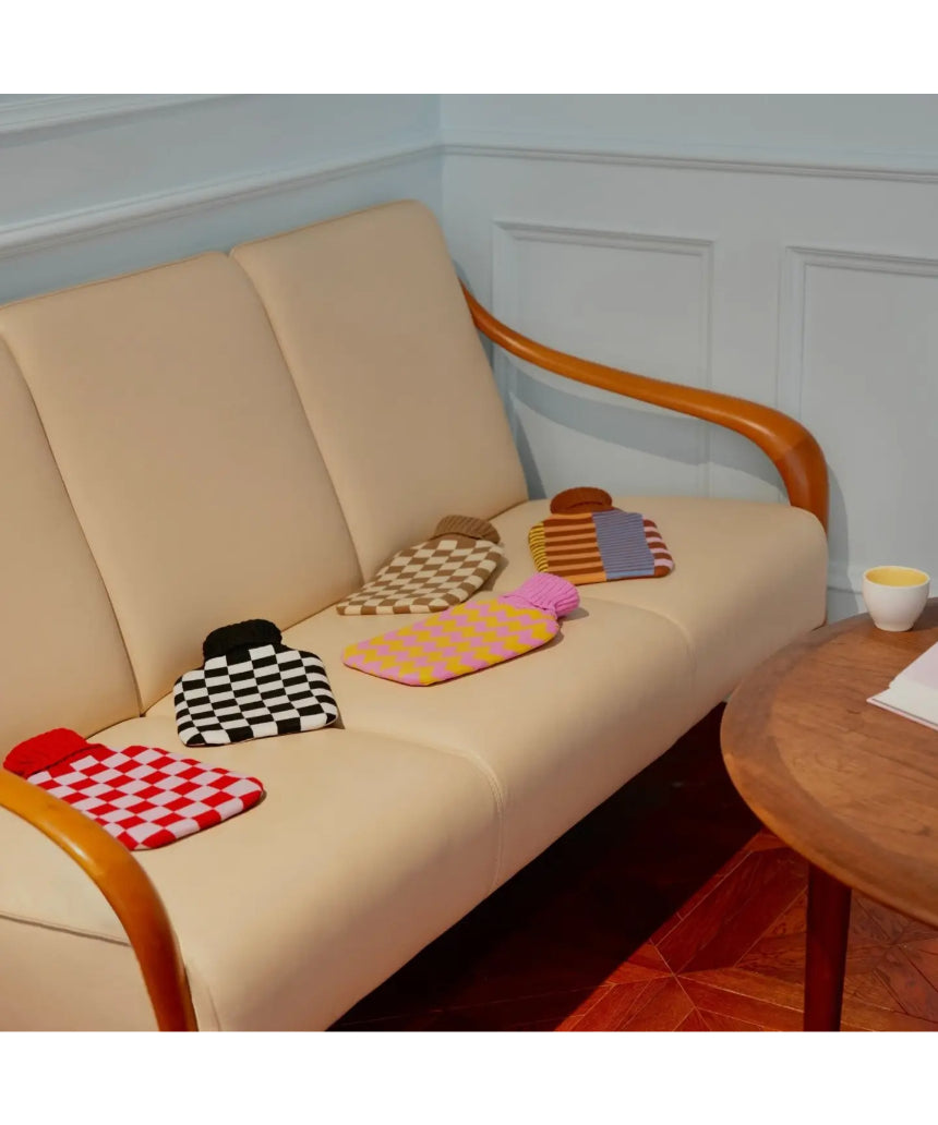 Casa Rolio hot water bottle with an artistic cover, featuring a vibrant, colorful design for cozy comfort.