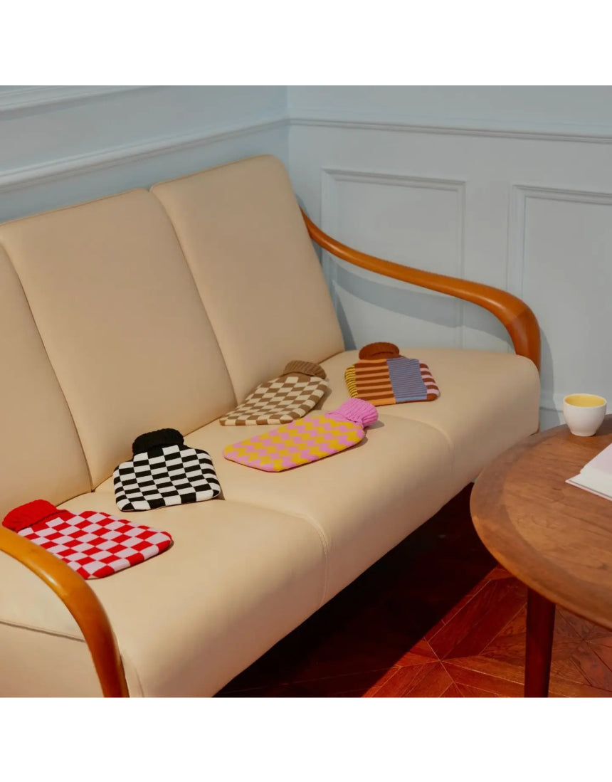 Casa Rolio hot water bottle with an artistic cover, featuring a vibrant, colorful design for cozy comfort.