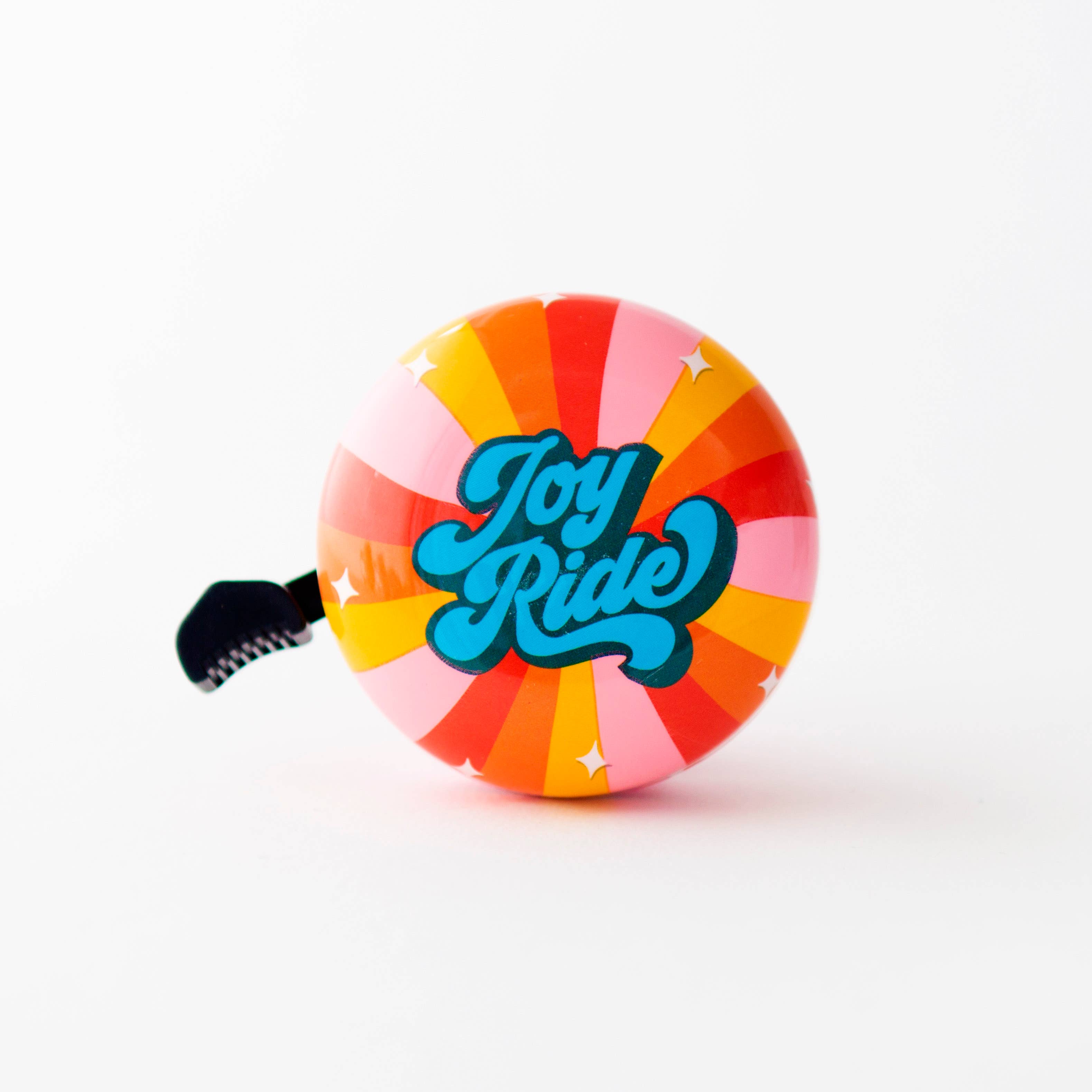 Pink Beep Joy Ride bike and scooter bell showing a colorful, playful design with a round bell shape and a mounting strap.