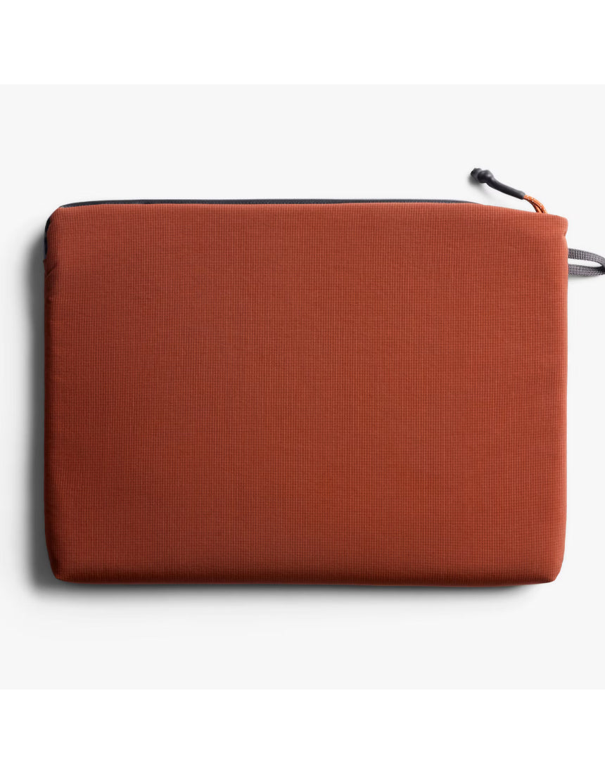 Bellroy Lite 14-inch Clay laptop sleeve showing a slim, soft fabric exterior with a minimalist design and a secure top opening.