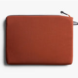 Bellroy Lite 14-inch Clay laptop sleeve showing a slim, soft fabric exterior with a minimalist design and a secure top opening.