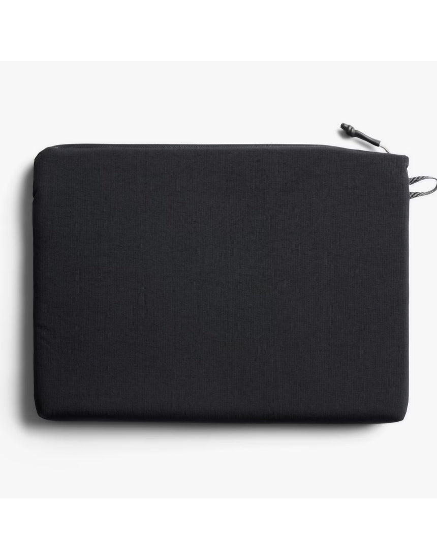Black Bellroy Lite 16-inch laptop sleeve with sleek design and padded interior for safe, stylish device protection.