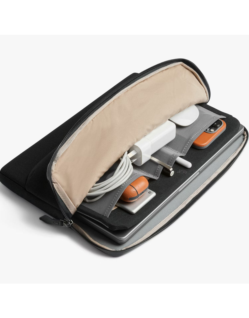 Black Bellroy Laptop Caddy for 14-inch laptops with organized compartments and sleek design, shown from a side view.