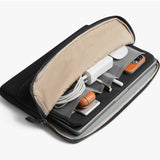 Black Bellroy Laptop Caddy for 14-inch laptops with organized compartments and sleek design, shown from a side view.
