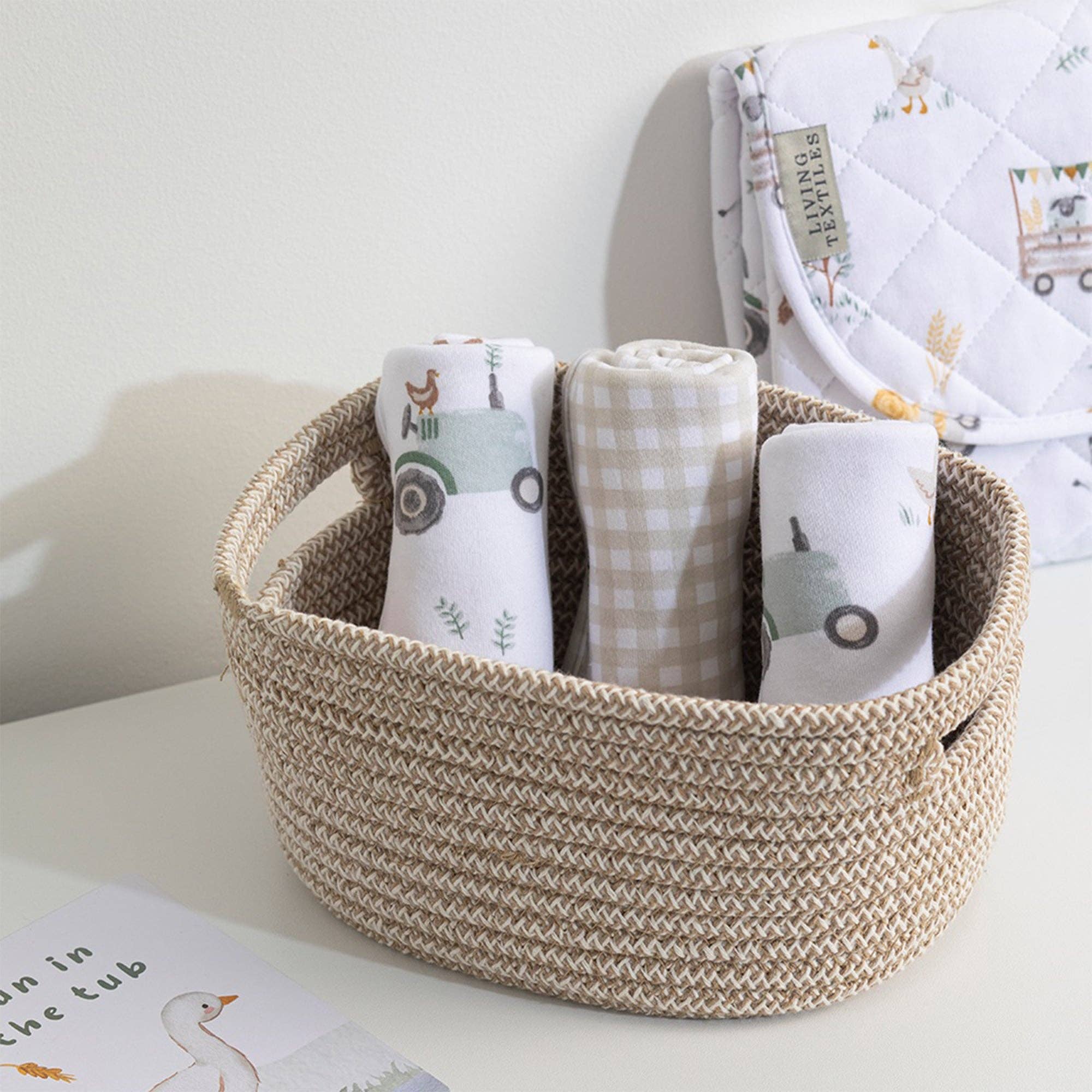 Living Textiles waterproof travel change mat with tractor ride design, foldable for easy diaper changes on the go.
