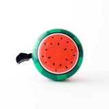 Red Beep Watermelon bike and scooter bell with watermelon design and bell mechanism, mounted on a bike handlebar.