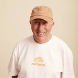 Banabae Rad Pop Washed Baseball Cap in desert sand, showing the washed fabric texture and curved brim on a casual cap.