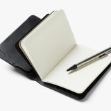 Bellroy black notebook cover featuring sleek leather design and minimalist style, ideal for protecting and organizing notebooks.