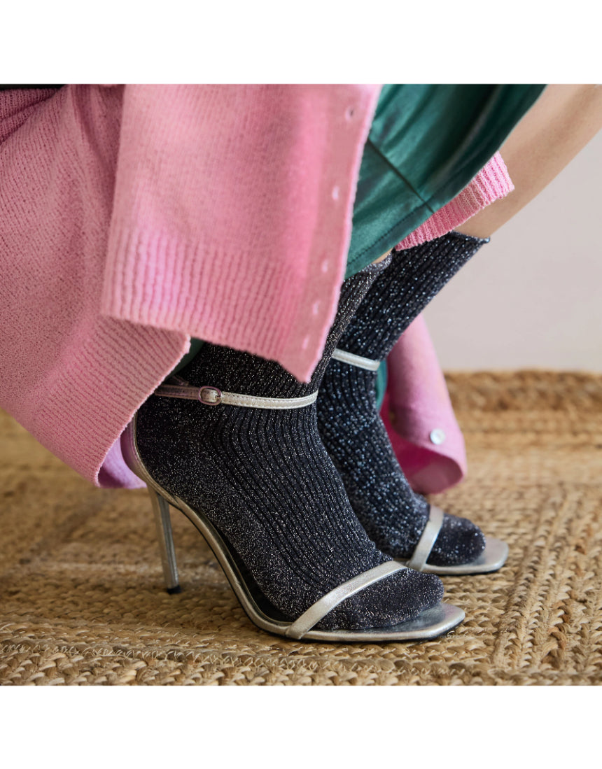 Grey glitter lurex socks by Klue, featuring shiny, textured fabric and a cozy fit for stylish comfort.