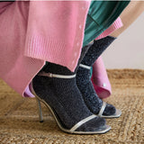 Grey glitter lurex socks by Klue, featuring shiny, textured fabric and a cozy fit for stylish comfort.
