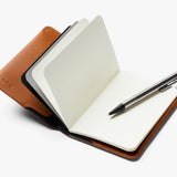 Bellroy notebook cover in caramel leather with sleek design and secure closure for protecting notebooks and stationery.
