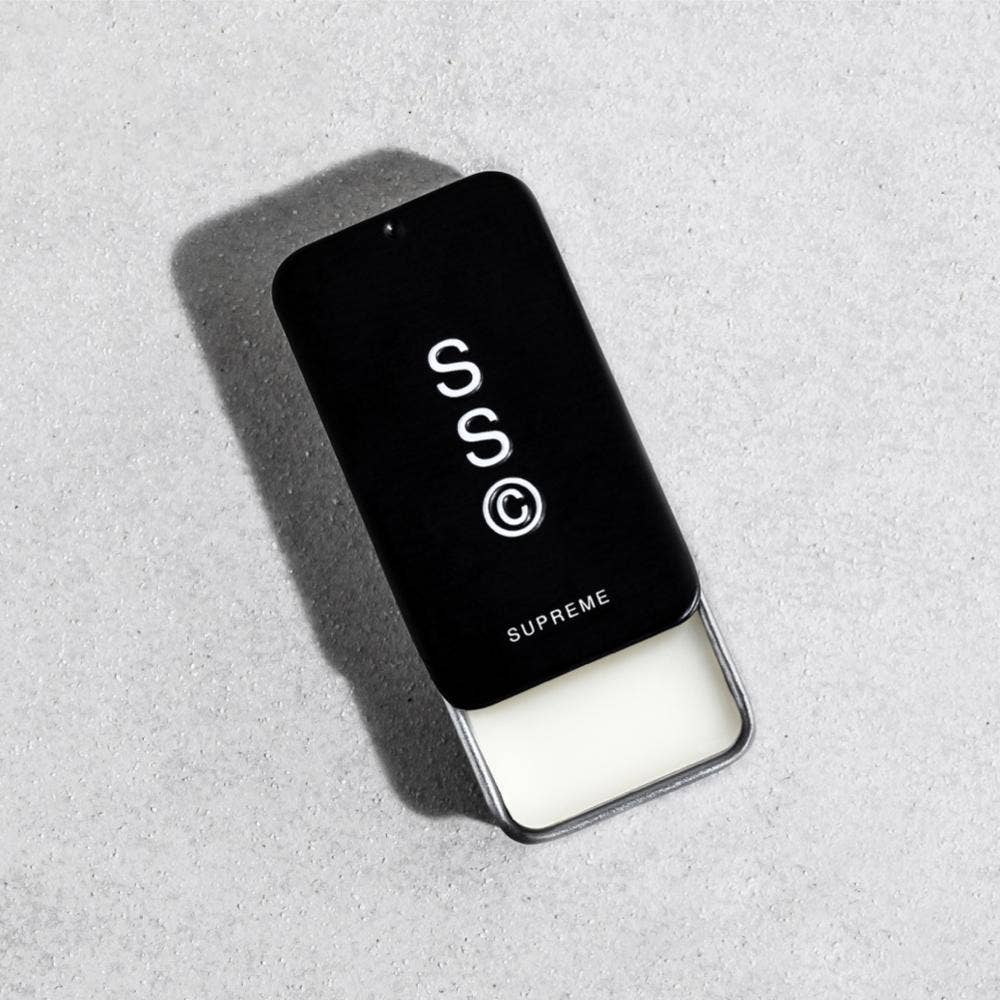 Solid State Supreme Solid Cologne in a sleek container, showcasing the premium packaging and clean design.