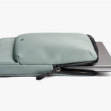Bellroy 14-inch Laptop Caddy in Eucalyptus with organized compartments for accessories and laptop storage.