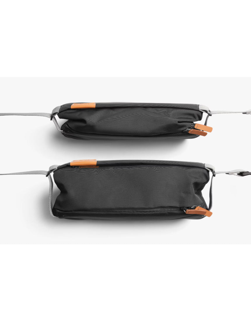 Bellroy sling bag in slate color, compact and stylish with adjustable strap, perfect for carrying essentials comfortably.
