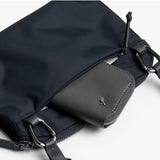 Bellroy Tokyo Side Bag in navy, a stylish crossbody bag with sleek design, adjustable strap, and multiple compartments.