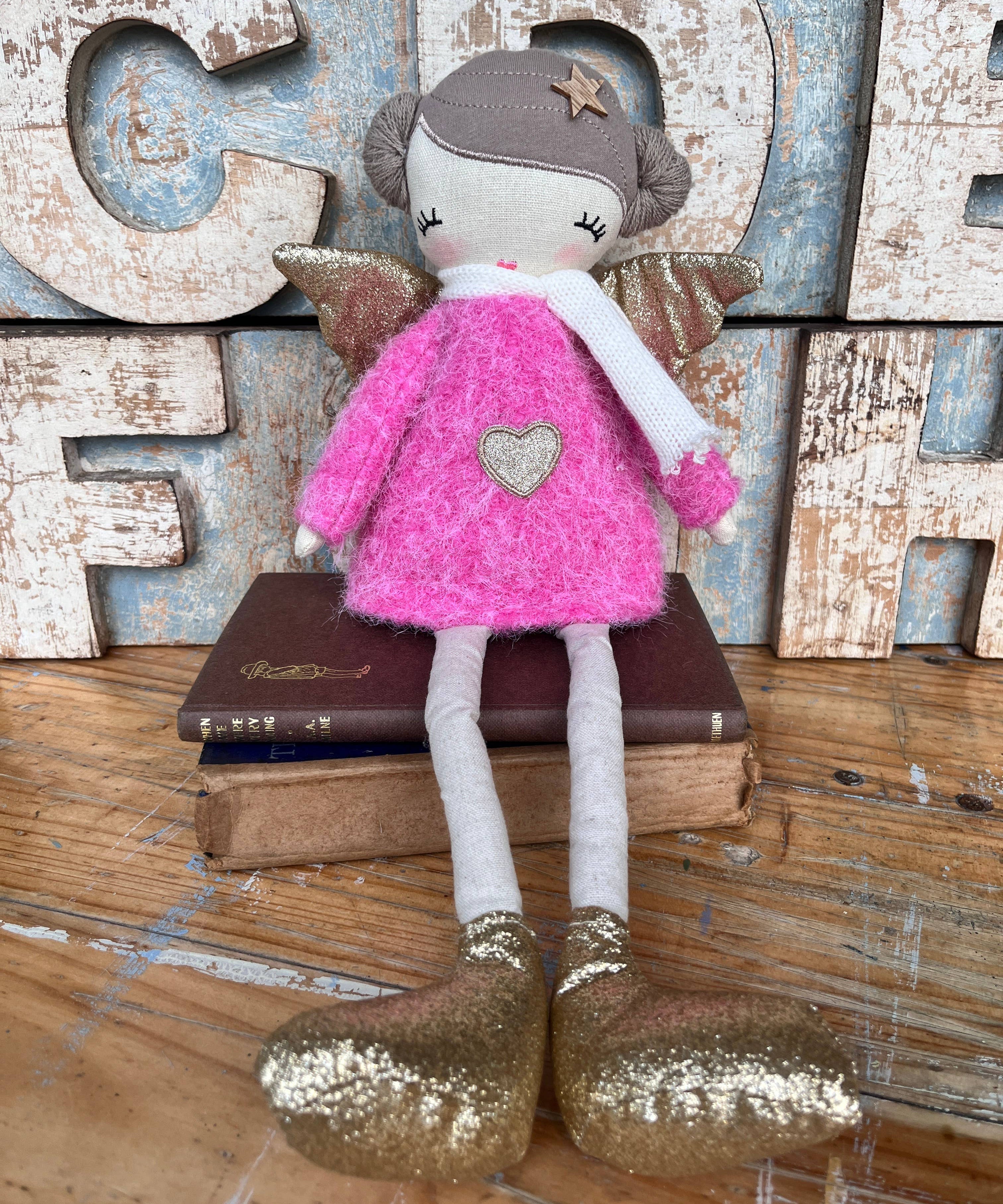 Amaranta Designs Bubblegum Doll with vibrant pink hair and colorful outfit, posing against a neutral background