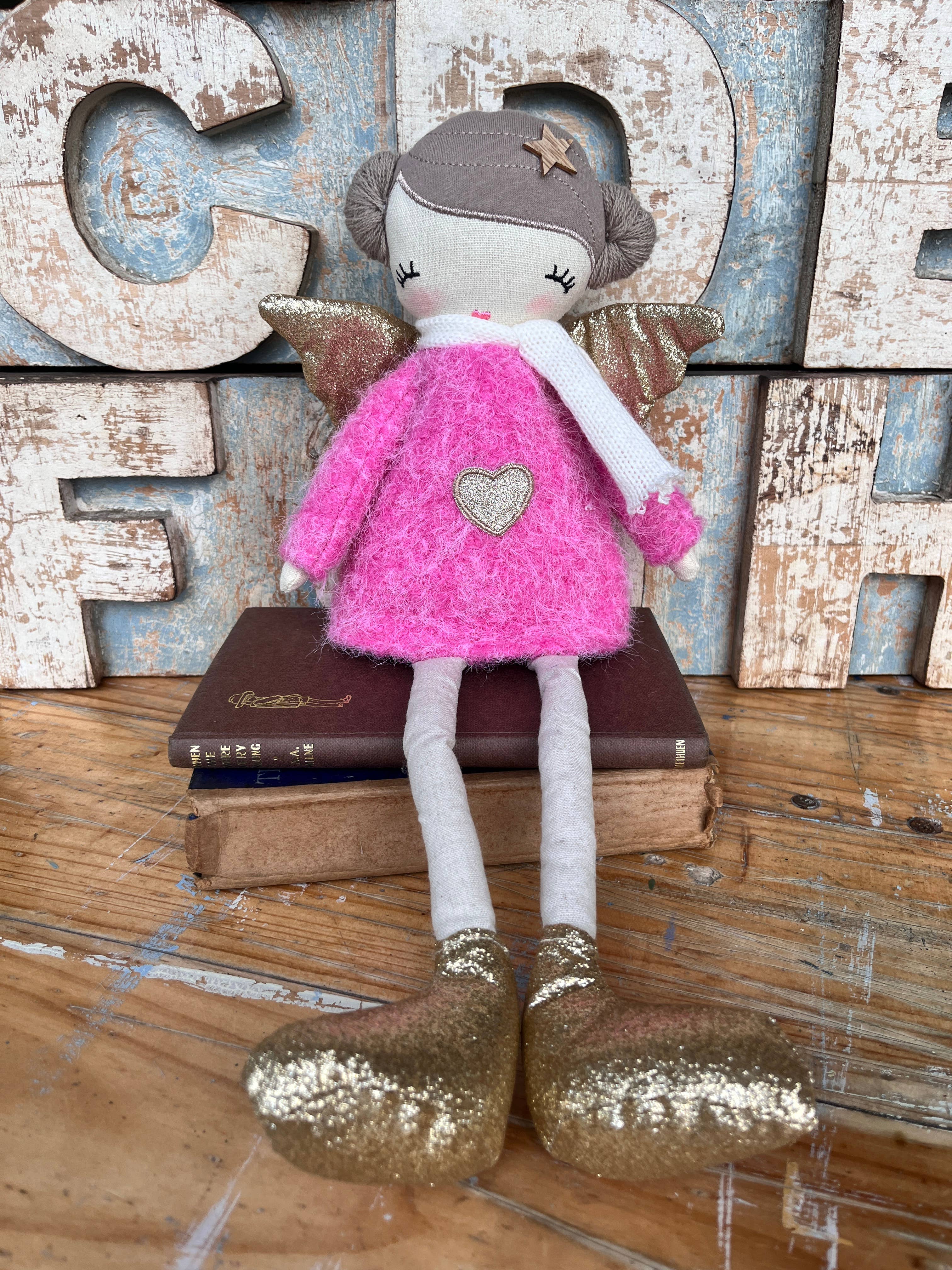 Amaranta Designs Bubblegum Doll with vibrant pink hair and colorful outfit, posing against a neutral background