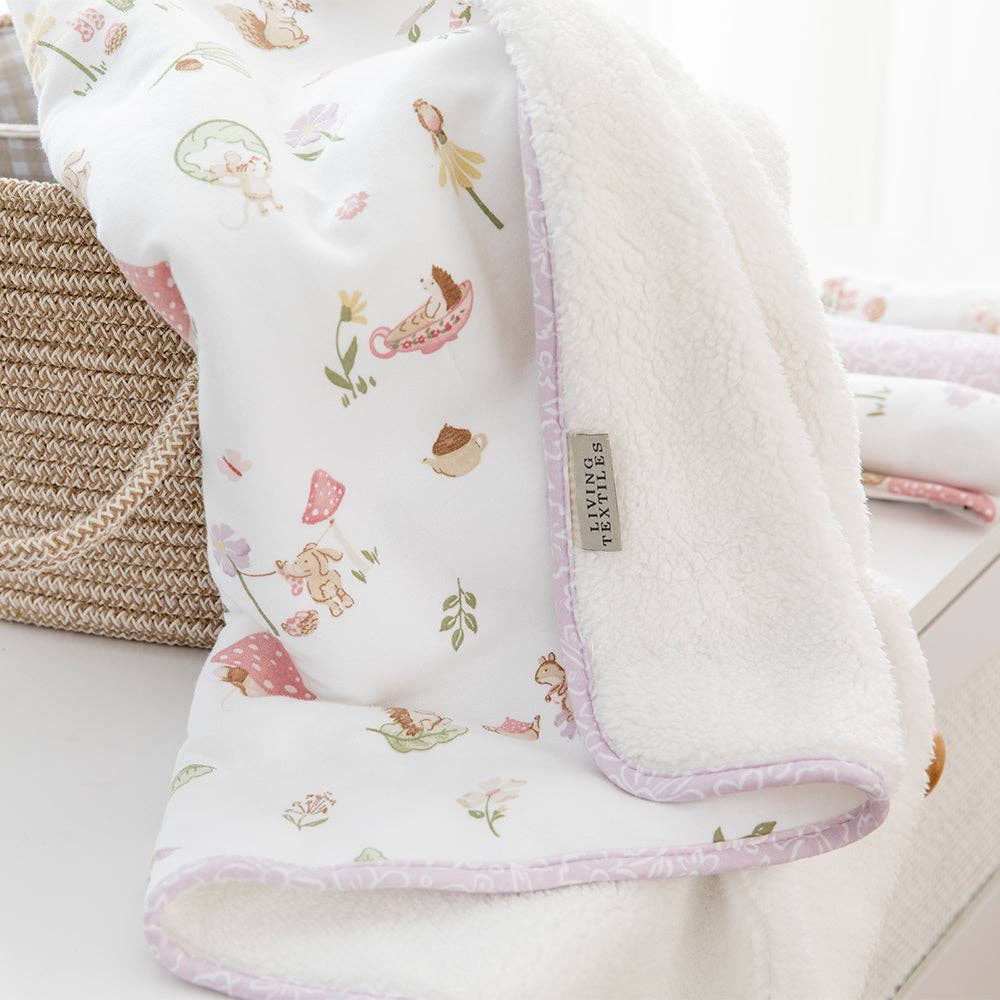 Living Textiles Jersey Sherpa Pram Blanket in Whimsical Wonderland with soft, cozy fabric and playful printed design for babies.