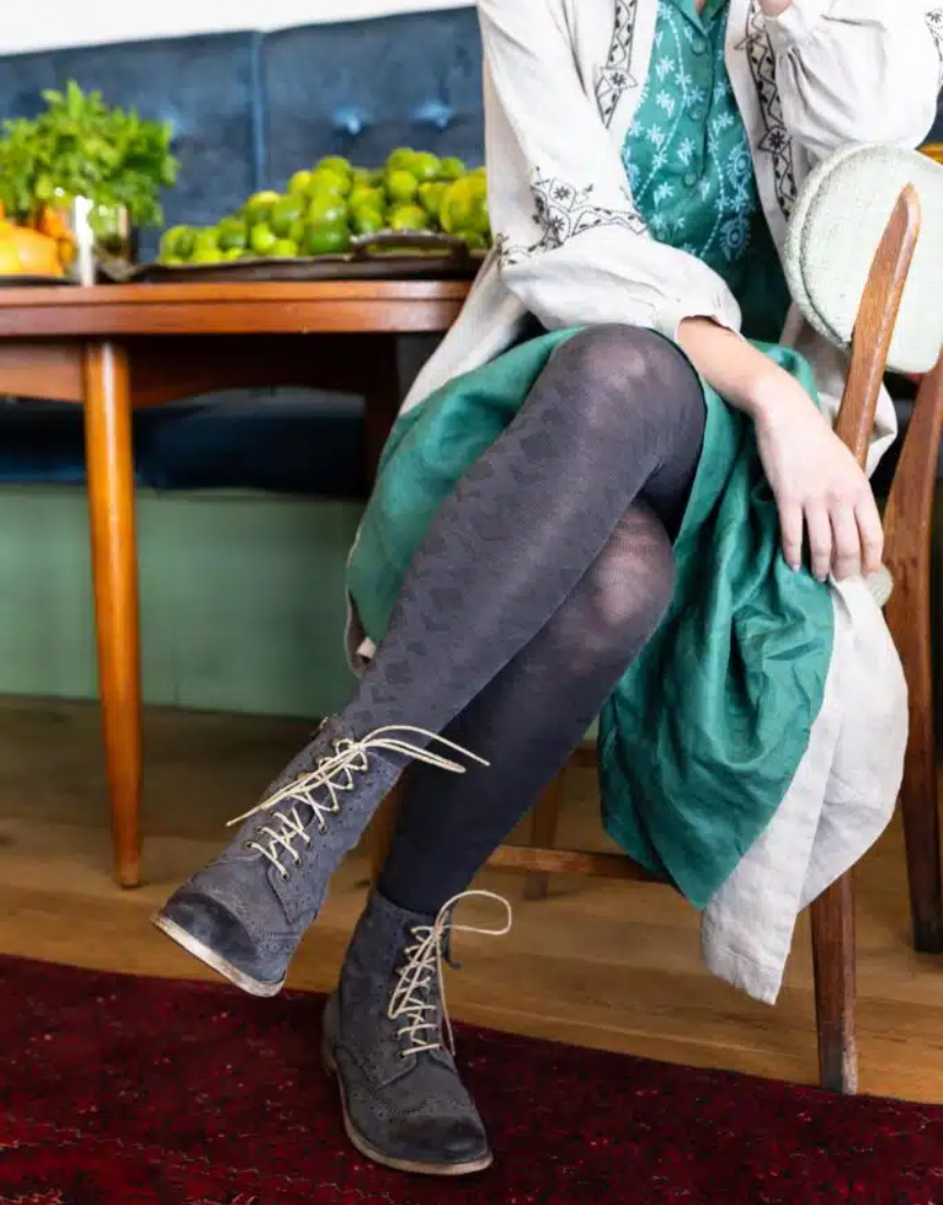 Tightology Deco Grey Merino Wool Tights displayed on a mannequin, showcasing their snug fit and soft wool texture.
