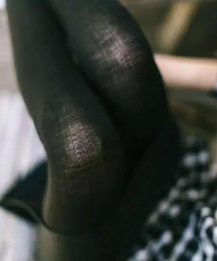 Black wool tights by Tightology featuring a smooth, fitted design suitable for stylish winter wear.