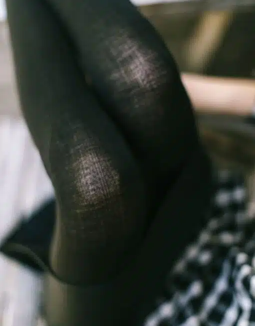 Black wool tights by Tightology featuring a smooth, fitted design suitable for stylish winter wear.
