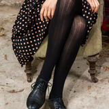 Black cotton tights by Tightology featuring a snug fit and smooth texture, ideal for stylish, comfortable wear.