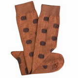 Tightology Yayoi Paprika Merino Wool Socks featuring bright red and orange patterns and soft wool texture.