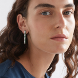 Elk Margit stud earring featuring a small, elegant silver design with a textured finish and post-back closure.