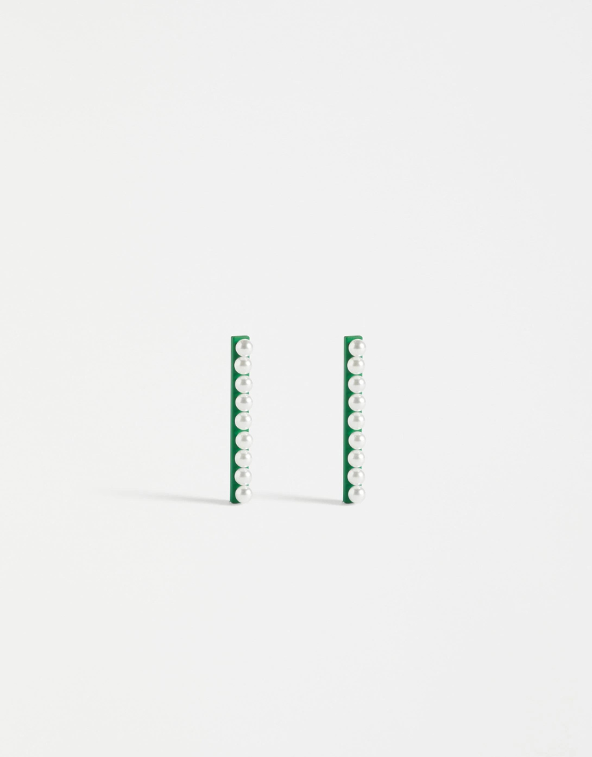 Elk Margit Stud Earring featuring a minimalist design with a small, round silver stud on a plain background.