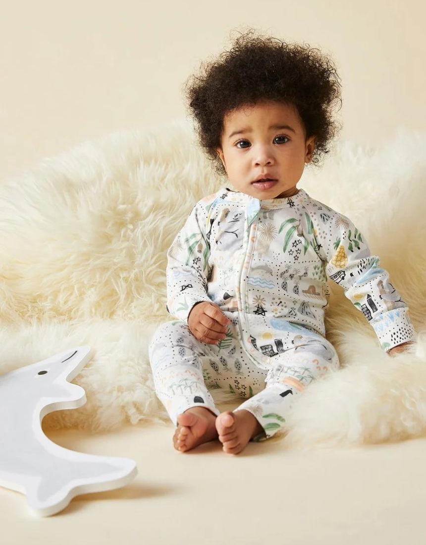 Baby Halcyon Nights Big Adventures long sleeve zip suit with colorful adventure print and soft fabric for comfortable wear.