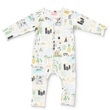 Baby wearing Halcyon Nights Big Adventures long sleeve zip suit, featuring colorful adventure-themed print and soft fabric.