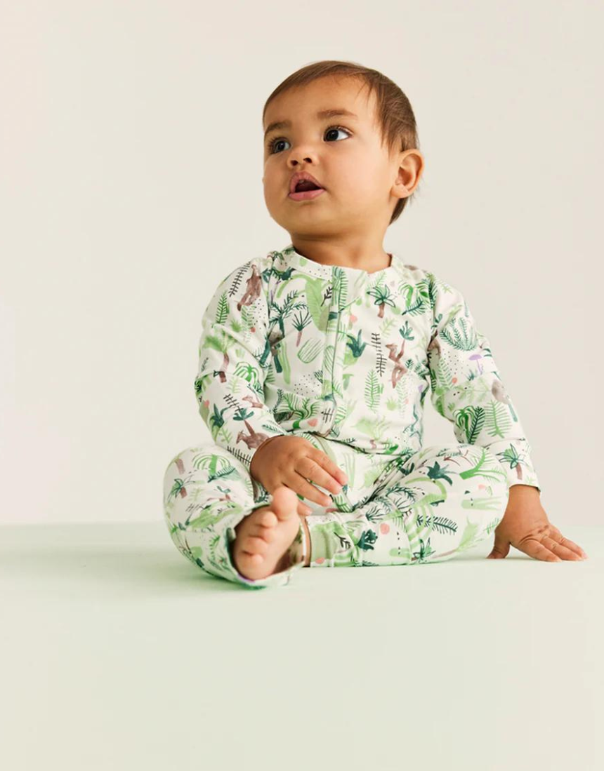 Baby Halcyon Nights Fern Gully long sleeve zip suit featuring a leafy green fern pattern on soft fabric.