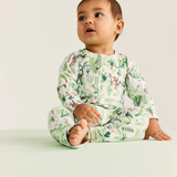 Baby Halcyon Nights Fern Gully long sleeve zip suit featuring a leafy green fern pattern on soft fabric.