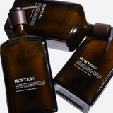 Hunter Lab Forever Kit for bath and body, featuring skincare products in sleek bottles and jars, designed for healthy skin.