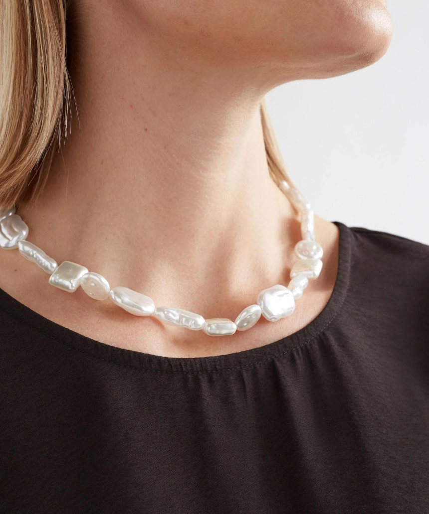 Elk Sota necklace featuring a silver chain with a minimalist pendant, stylish jewelry accessory for everyday wear