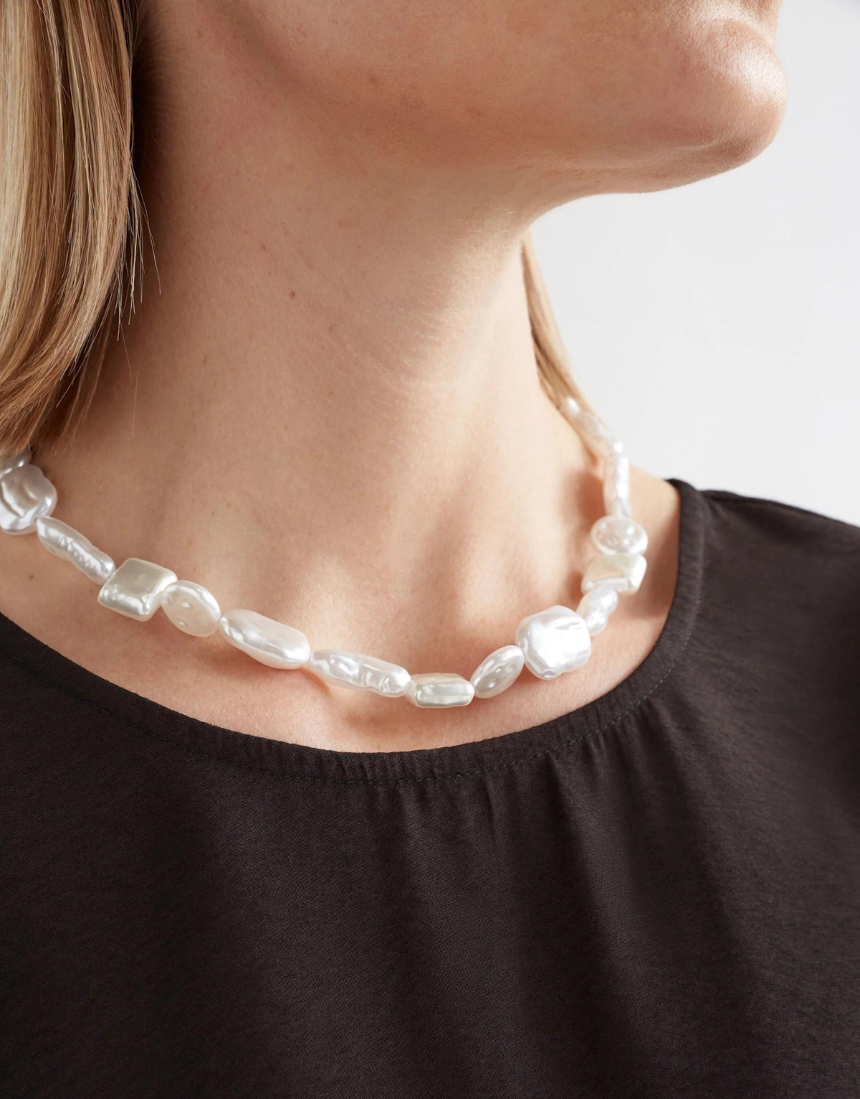 Elk Sota necklace featuring a silver chain with a minimalist pendant, stylish jewelry accessory for everyday wear